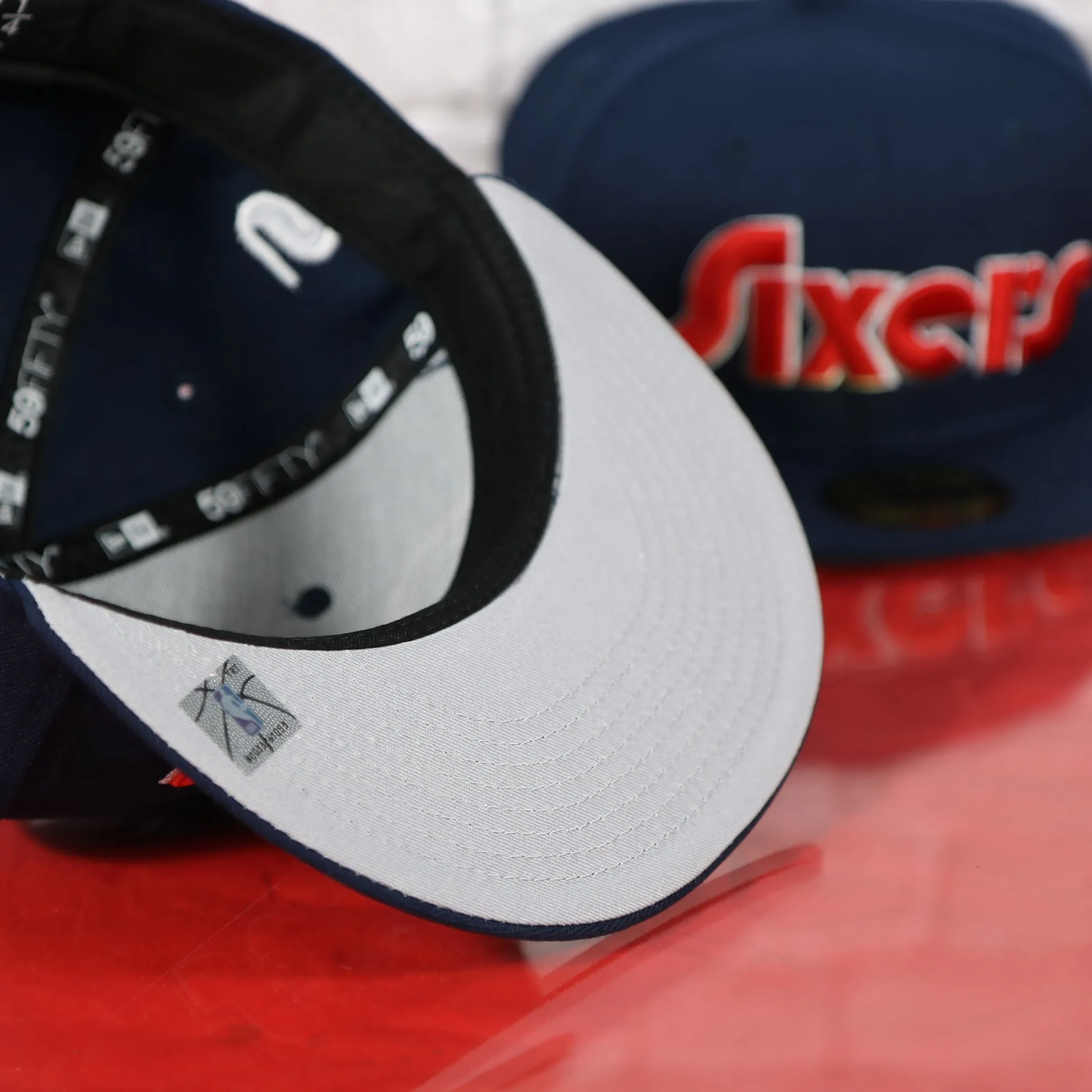 Philadelphia 76ers 2022 City Edition Sixers Script Spectrum Side Patch Navy 59Fifty Fitted Cap